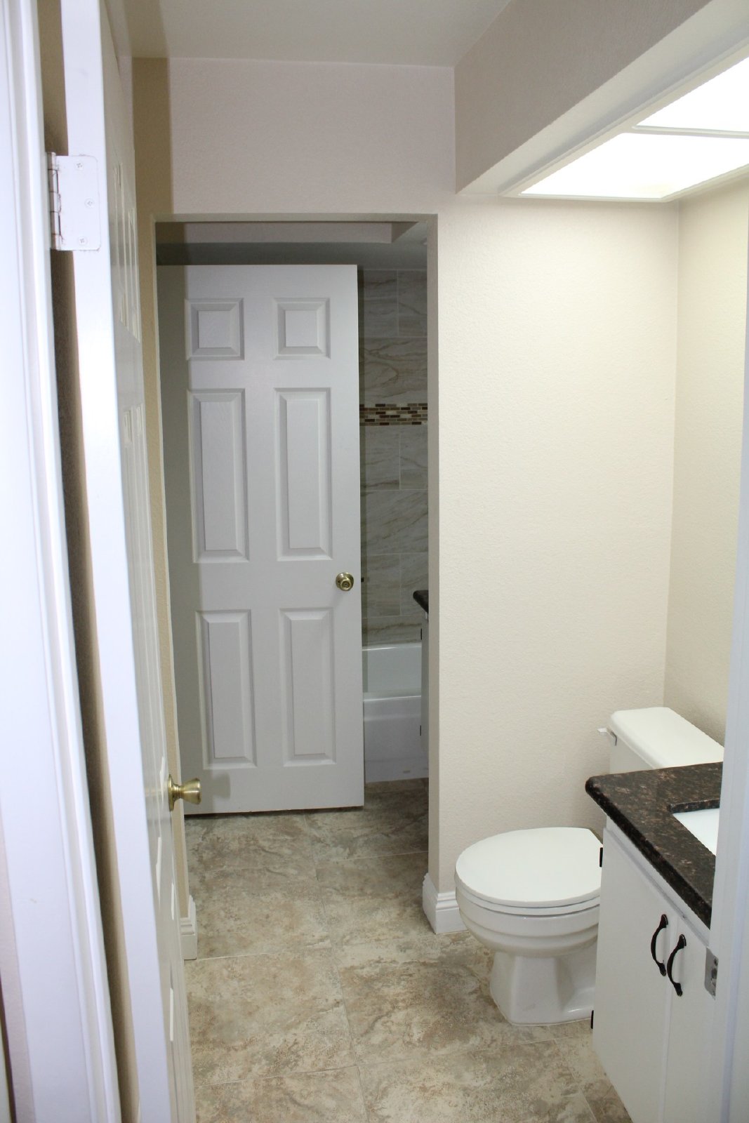 Single-story home with patio and garage property image